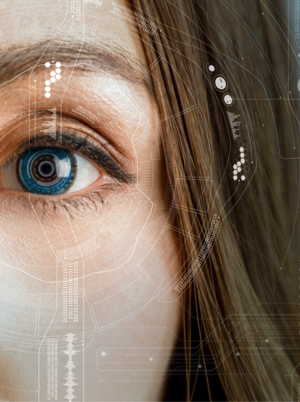 Woman's Eye Surrounded By Futuristic Holograms